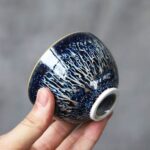 closeup of handcrafted japanese tenmoku starry sky tea bowl