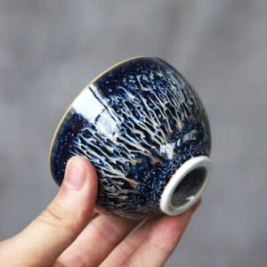 closeup of handcrafted japanese tenmoku starry sky tea bowl