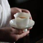 japanese white porcelain flower rim tea cup and saucer 2oz main product view