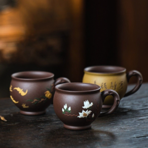 handmade japanese zisha clay tea cup with decorative motifs