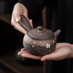 Handcrafted Japanese Kyusu Teapot with infuser and matching textured tray, silver floral decor