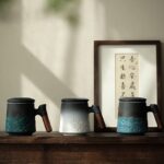 full view of black and white gradient japanese loose leaf tea infuser mug with wooden handle