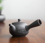 full product shot of textured dark gray ceramic kyusu teapot