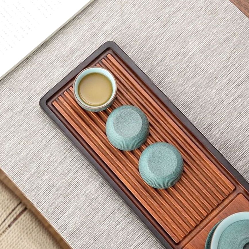 top view of two vintage green japanese tea bowls showing pale interior color