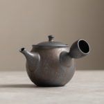 front view of vintage dark gray ceramic kyusu teapot with side handle