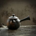 full view of vintage rustic ceramic kyusu teapot with side handle