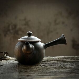 full view of vintage rustic ceramic kyusu teapot with side handle