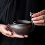 vintage coarse pottery branch handle fairness cup gong dao bei 6oz tea pitcher side view