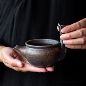 vintage coarse pottery branch handle fairness cup gong dao bei 6oz tea pitcher side view