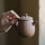 vintage japanese aged clay teapot 5.4oz held in hand