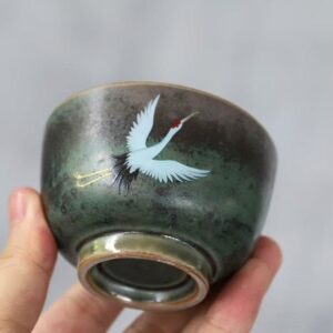 side view of vintage hand-painted japanese crane japanese tea bowl