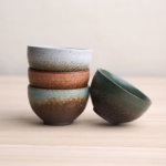 collection of handcrafted vintage japanese tea bowls in different glazes