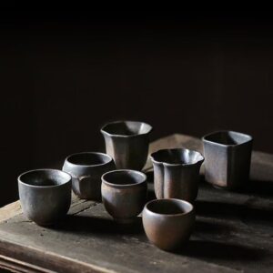 vintage handcrafted japanese tea cup set with varied metallic glaze shapes