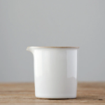 Minimalist white ceramic Japanese fairness cup with gold trim